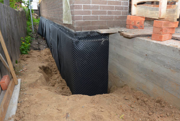 Happy homeowners after waterproofing job in New Liberty